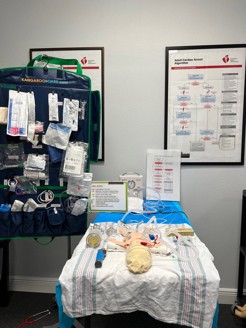 Kangaroo Board supporting an infant resuscitation setup